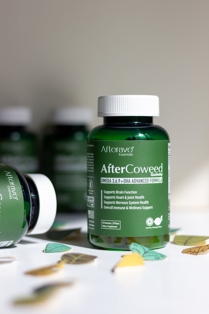 Image of AfterCoweed Omega 3,6,9+ DHA supplement bottle for brain and joint support.