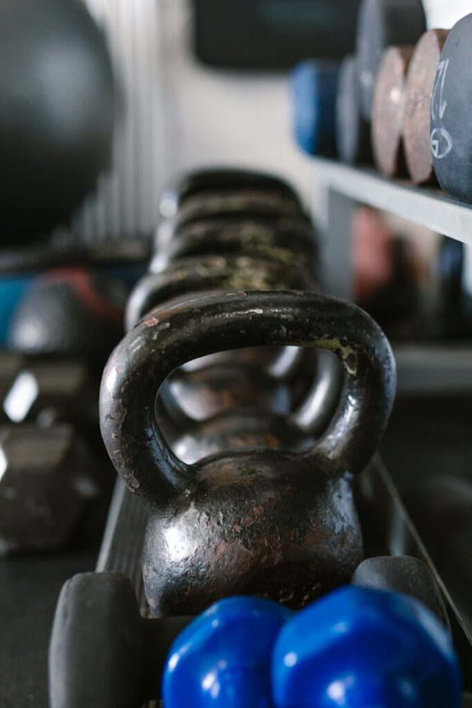 pexels photo 7187881 A close view of kettlebells and weights, showcasing essential gym equipment for strength training.